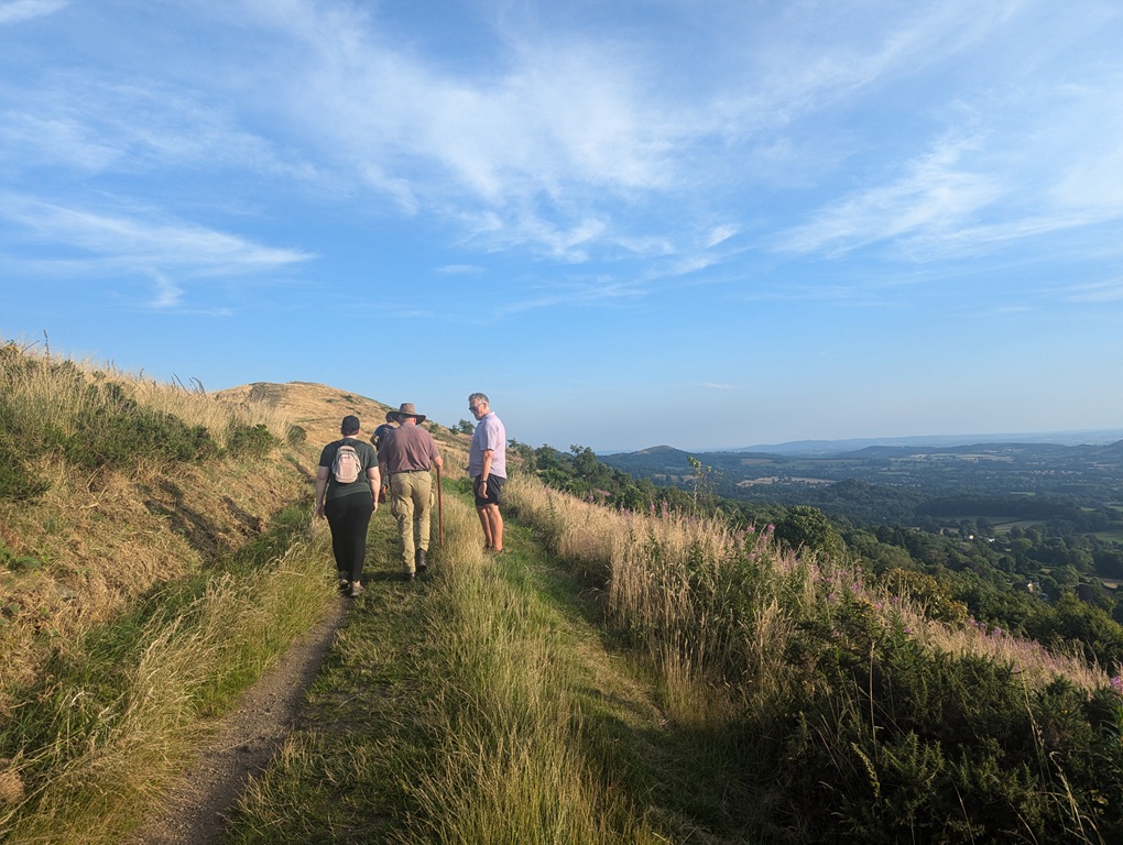 Walkers on the side of Worcester Beacon, Malvern. Walking Festival